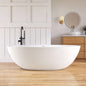Modern bathroom with a freestanding bathtub, wooden vanity, and round mirror.