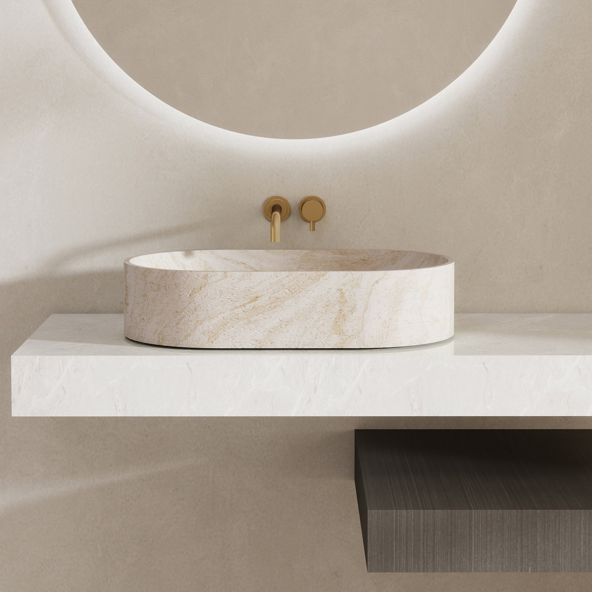 Marble pattern oval solid surface sink on a white countertop with a gold faucet.
