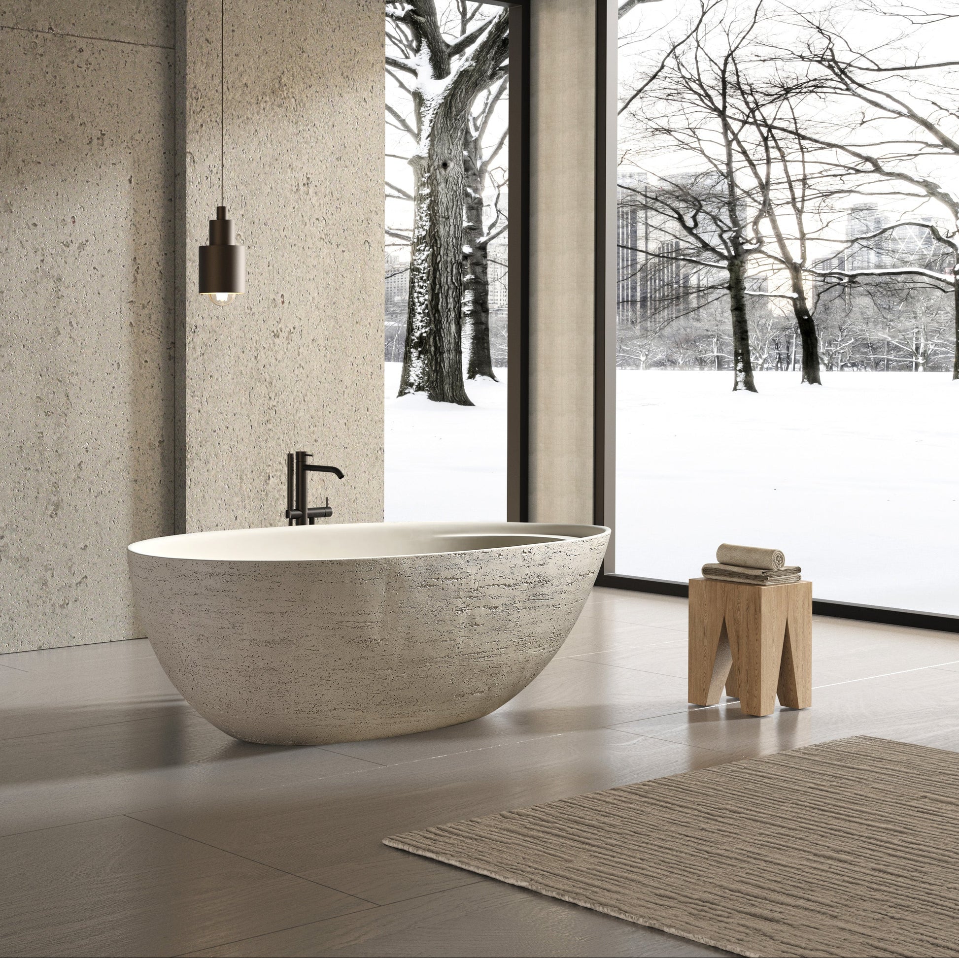 Modern bathroom with stone-look freestanding bathtub and sinks.
