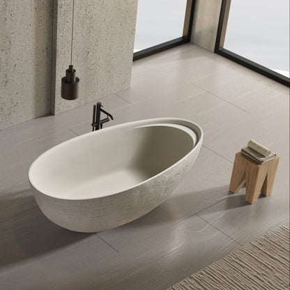 Modern bathroom with two standing sinks and a freestanding bathtub.