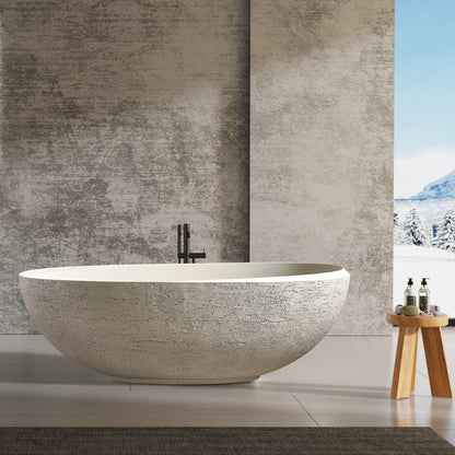 Modern bathroom with freestanding bathtub, sinks, and mirrors.