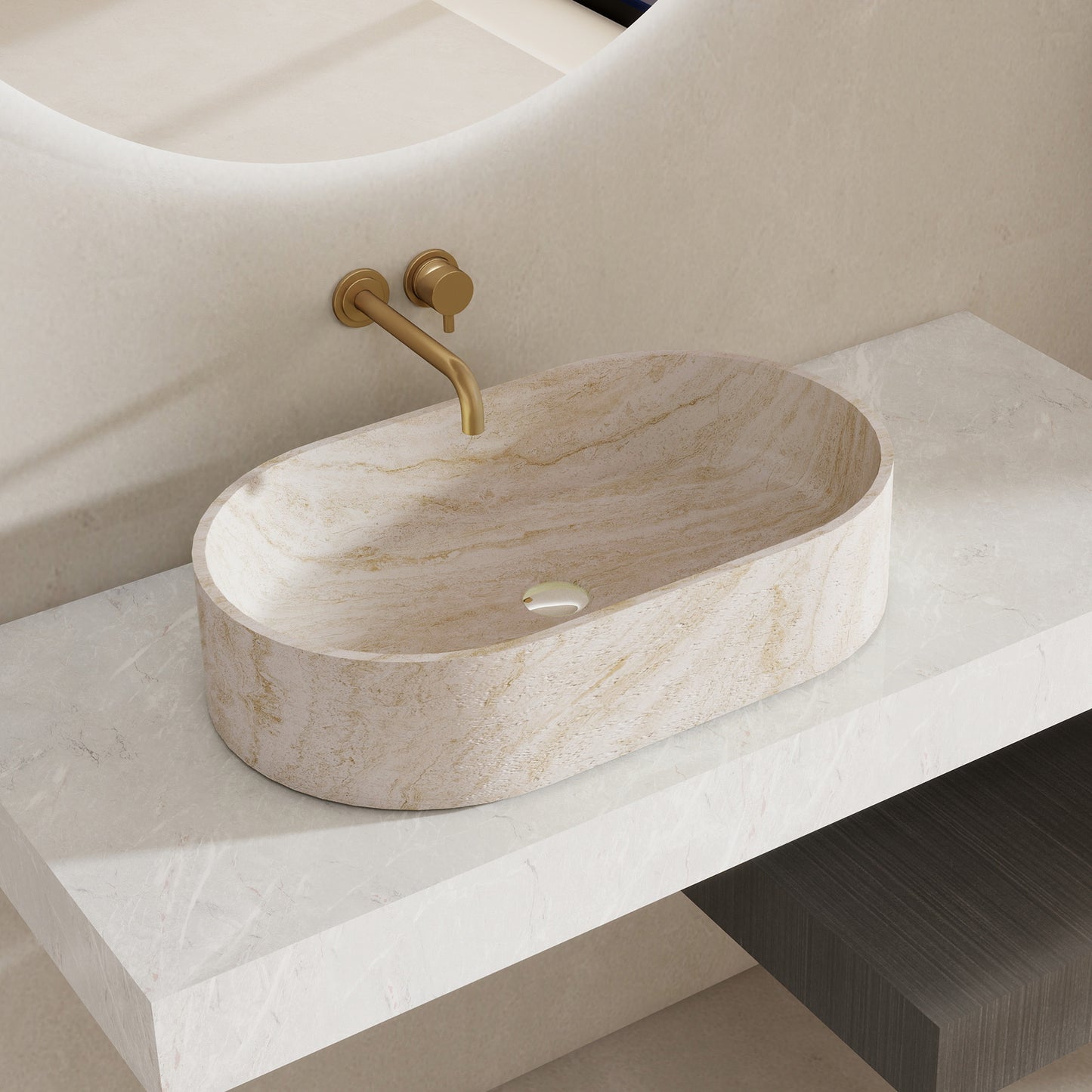Marble pattern oval solid surface sink on a white countertop with a gold faucet.