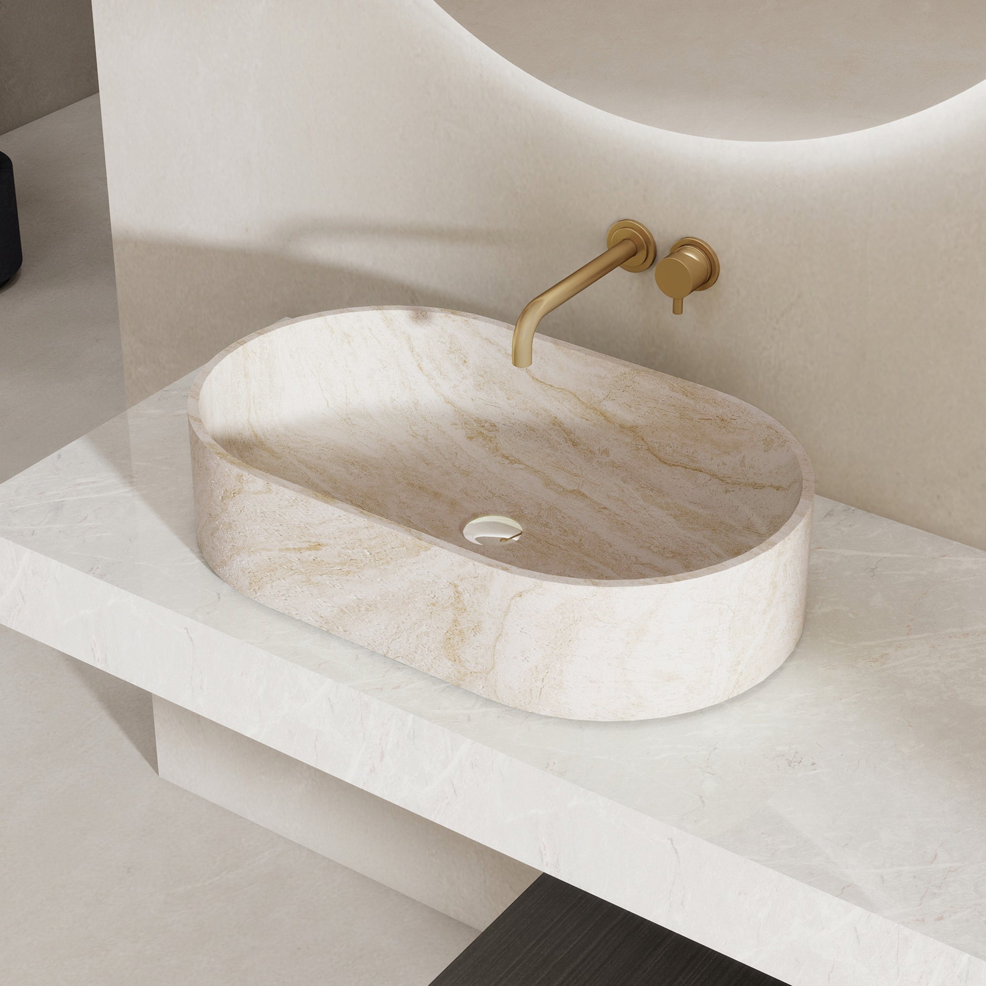 Marble pattern oval solid surface sink on a white countertop with a gold faucet.