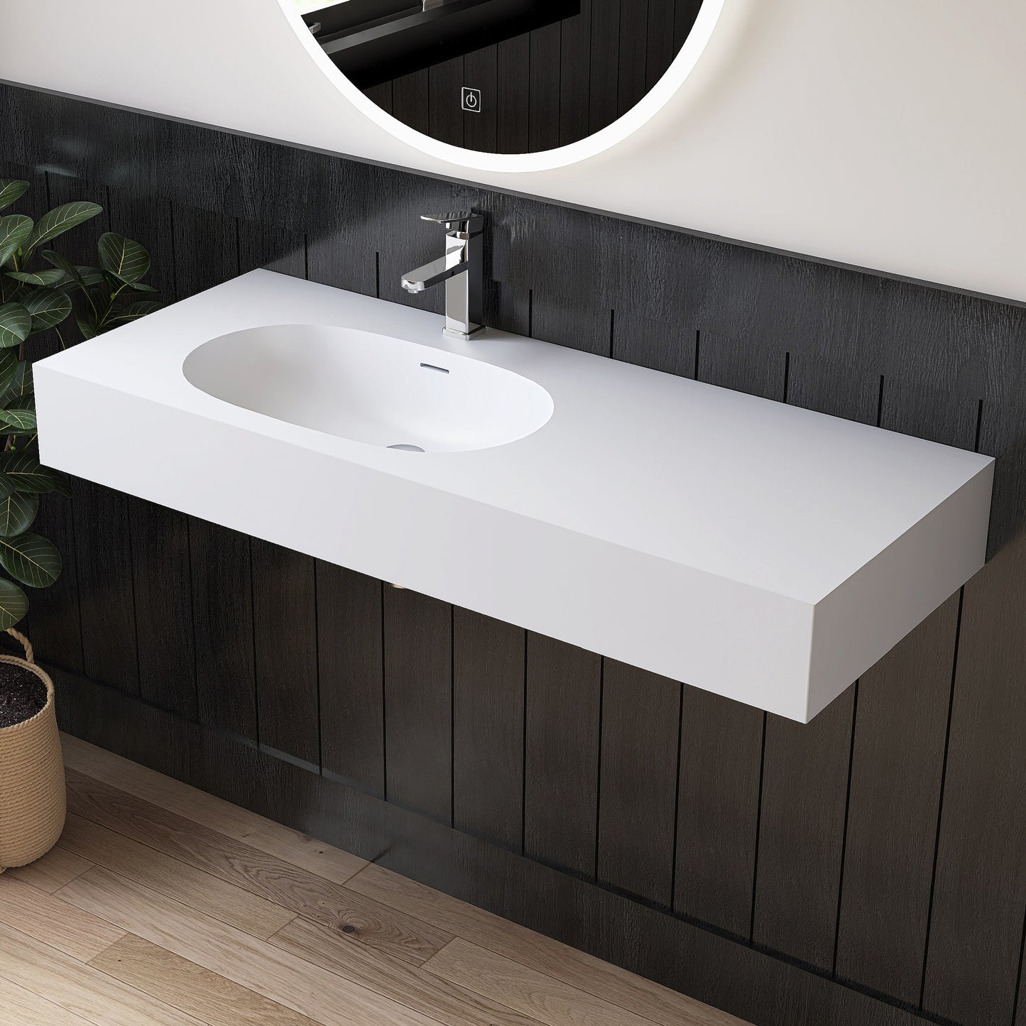 Bathroom vanity with white sink and black paneling