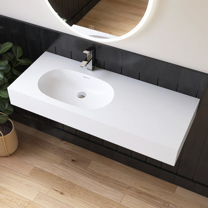 Modern bathroom vanity with white sink and illuminated mirror.