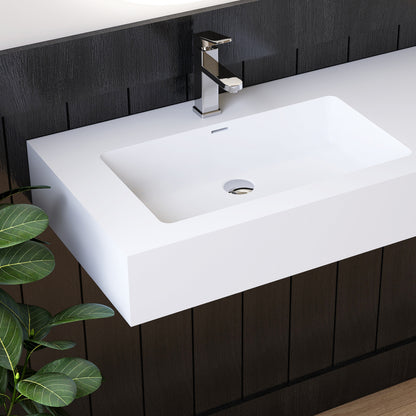 White wall mounted rectangular sink with chrome faucet against a dark wooden panel wall