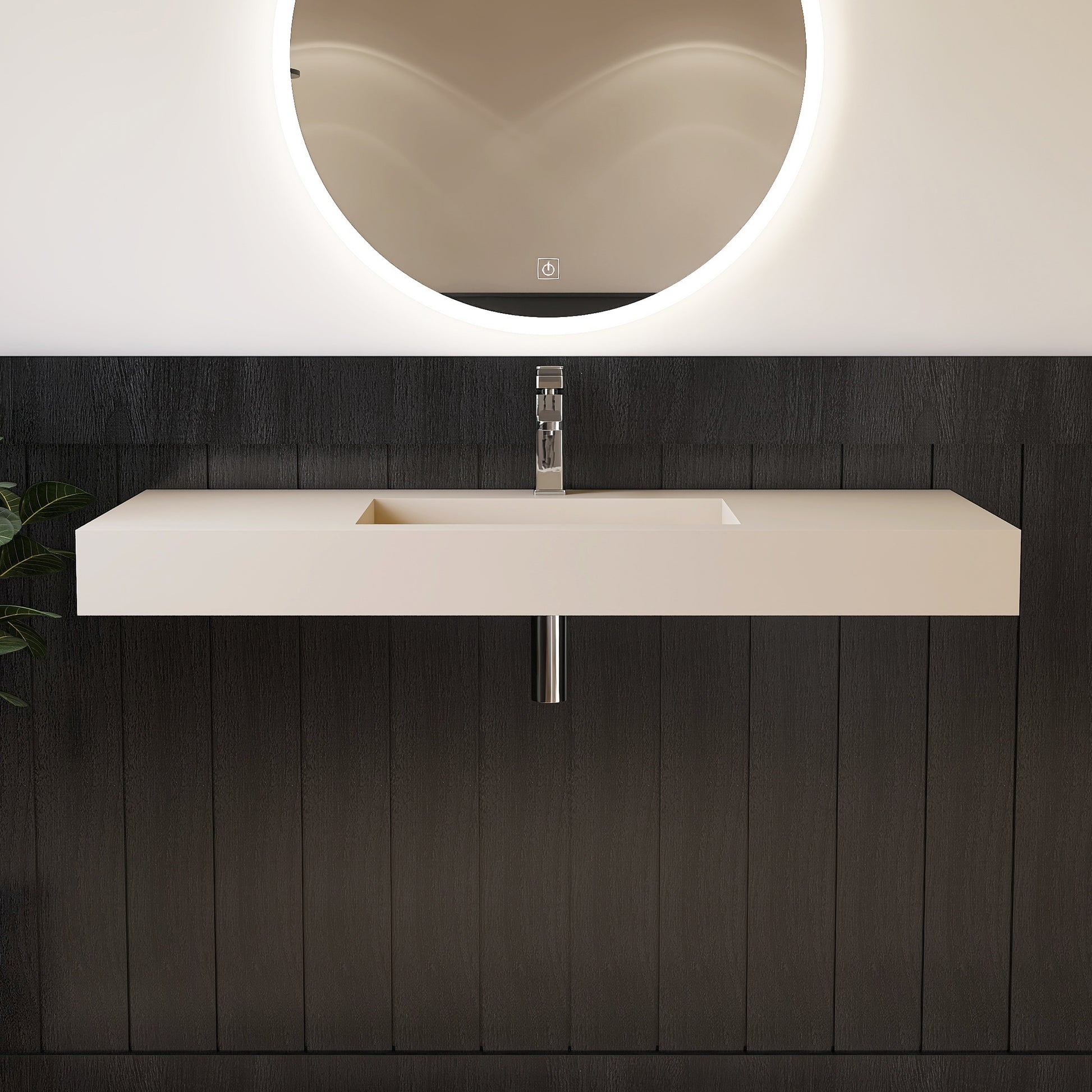 Modern bathroom vanity with wall mounted creamy beige sink and round mirror.