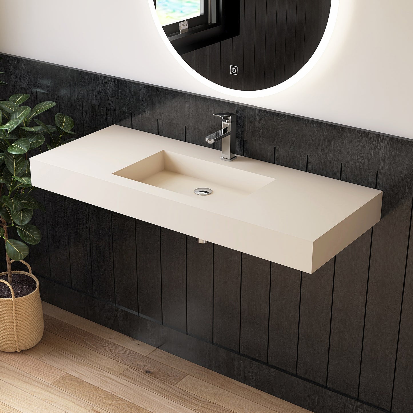 Bathroom vanity with wall mounted creamy beige sink against a dark wooden wall