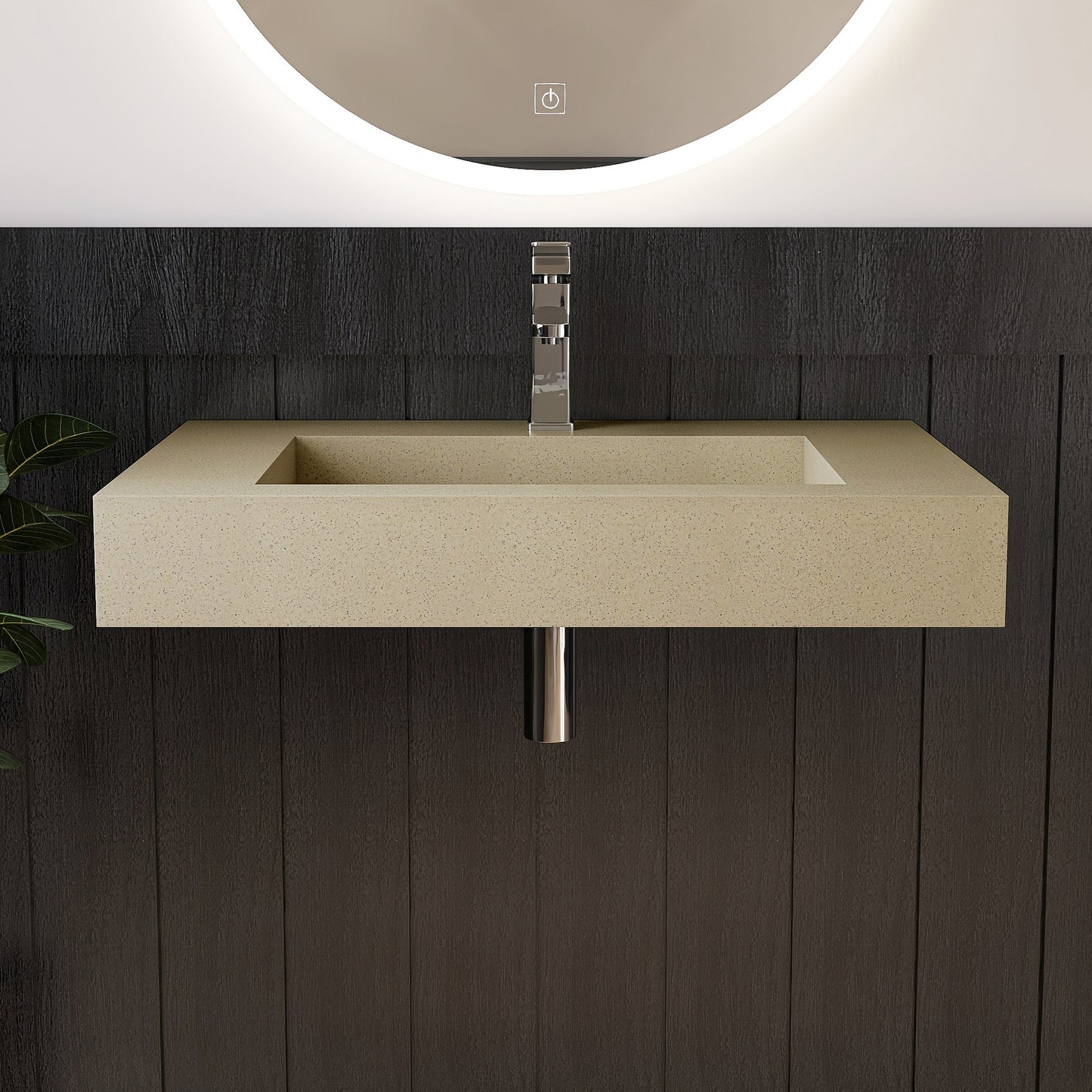 Beige wall mounted sink with metallic faucet against a dark wooden wall