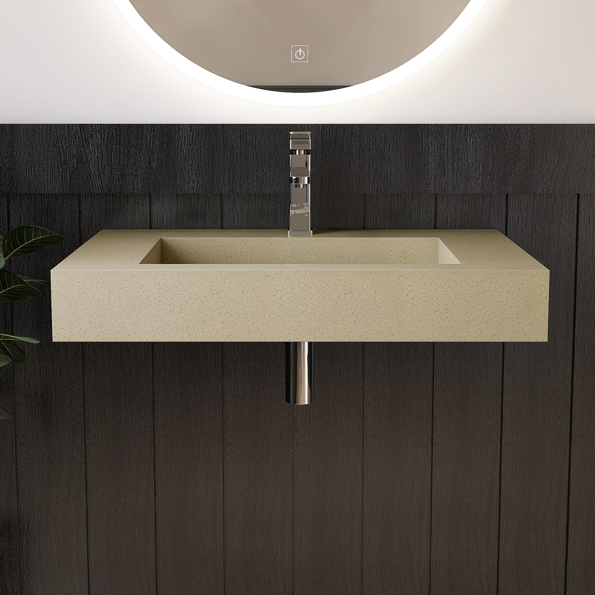 Beige wall mounted sink with metallic faucet against a dark wooden wall