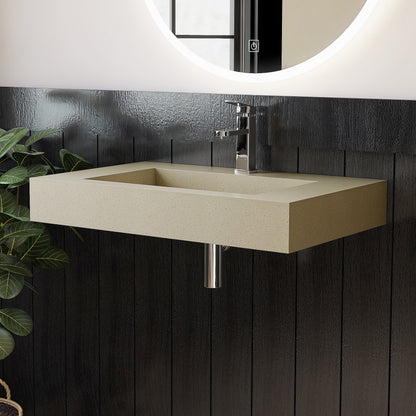 Beige wall-mounted sink with chrome faucet against a dark wooden panel wall.