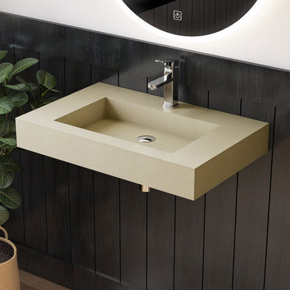 Beige wall mounted sink with silver faucet on a dark wooden wall