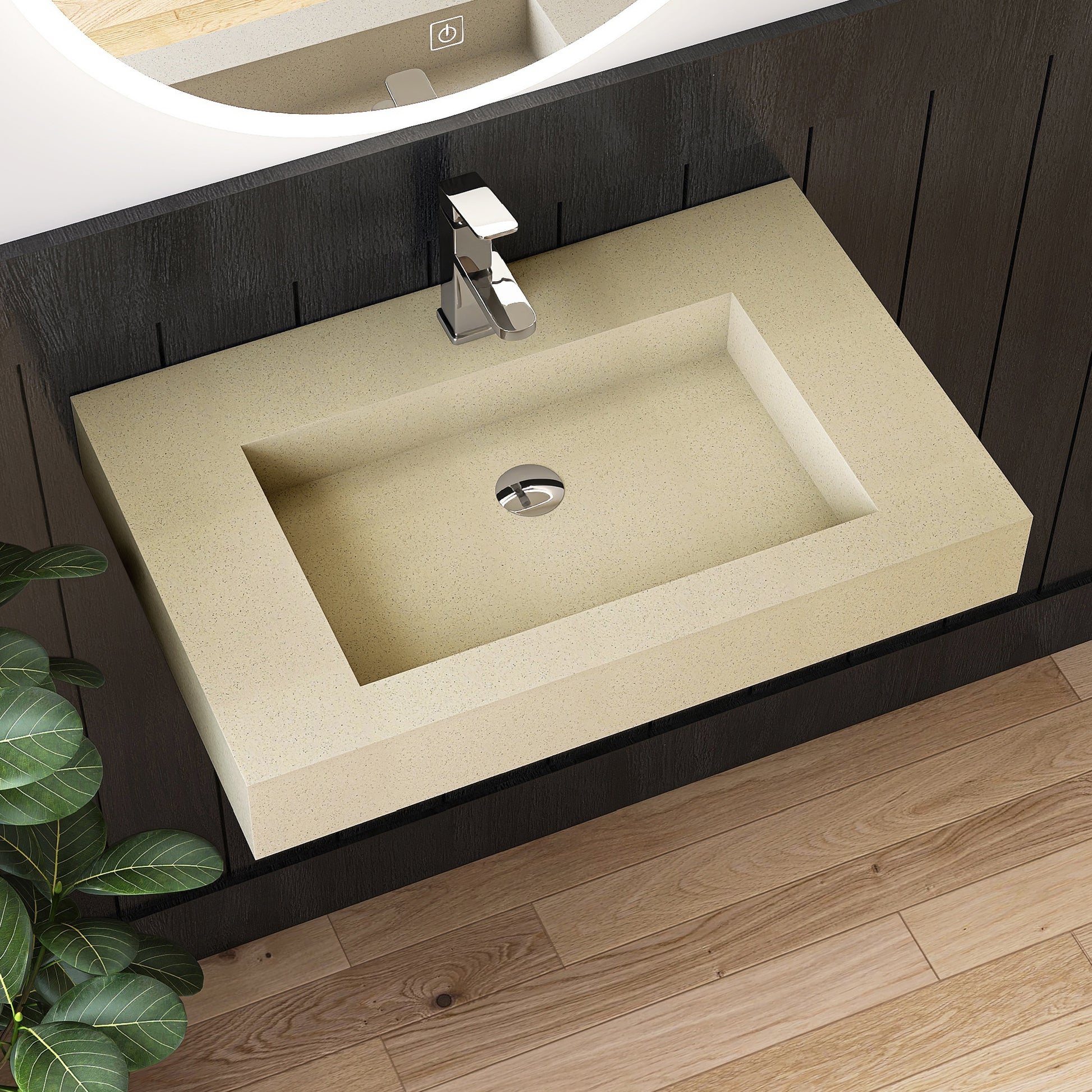 Beige wall mounted sink on a dark wooden vanity with a silver faucet