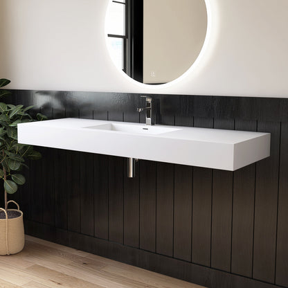 Modern bathroom with a white wall-mounted sink against a black paneled wall.