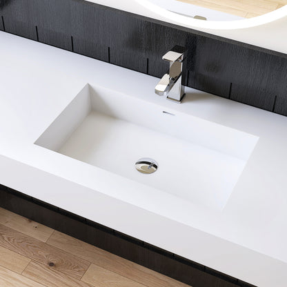 Modern white bathroom sink with chrome faucet against a black wall.