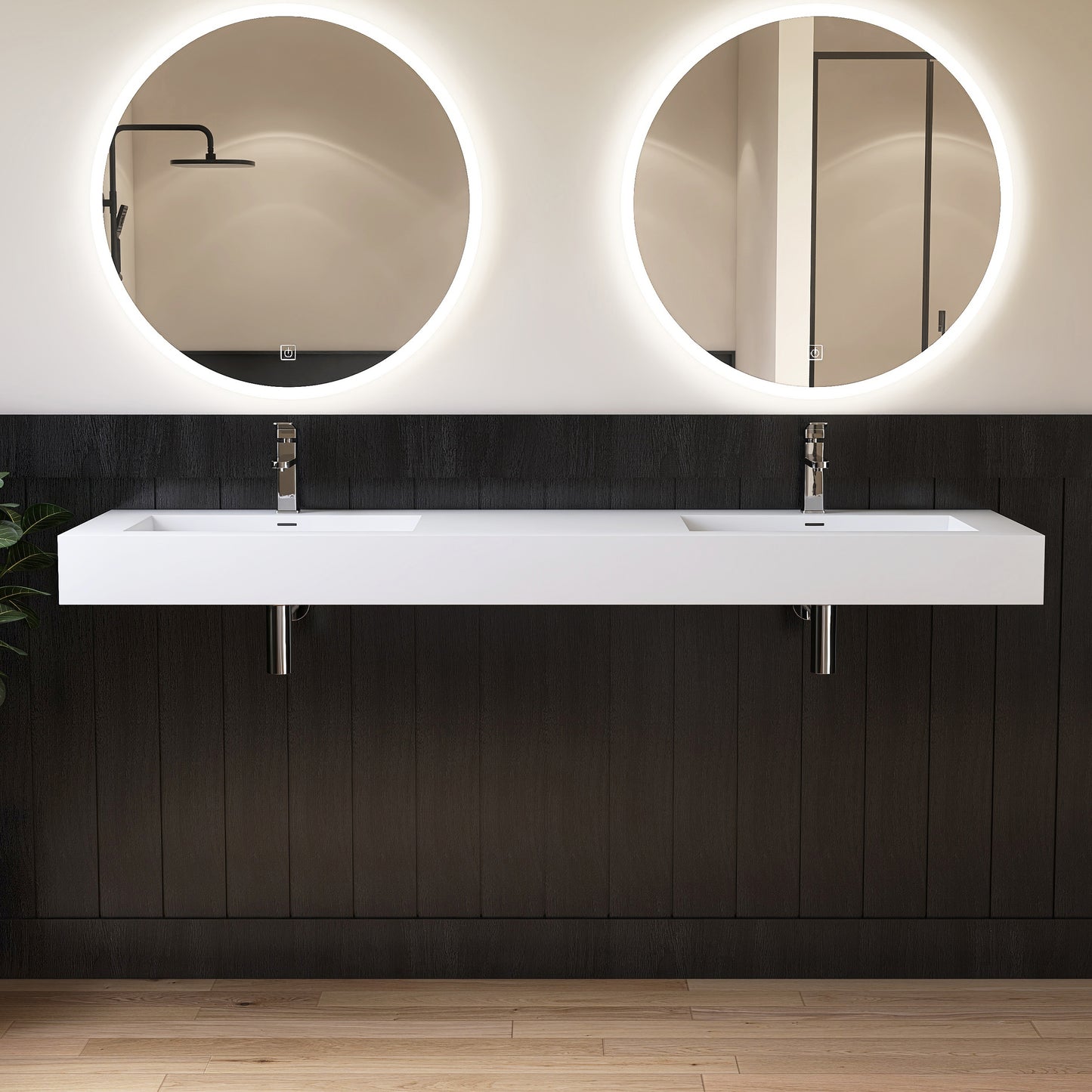Modern bathroom vanity with two round mirrors and a double wall-mounted sink.