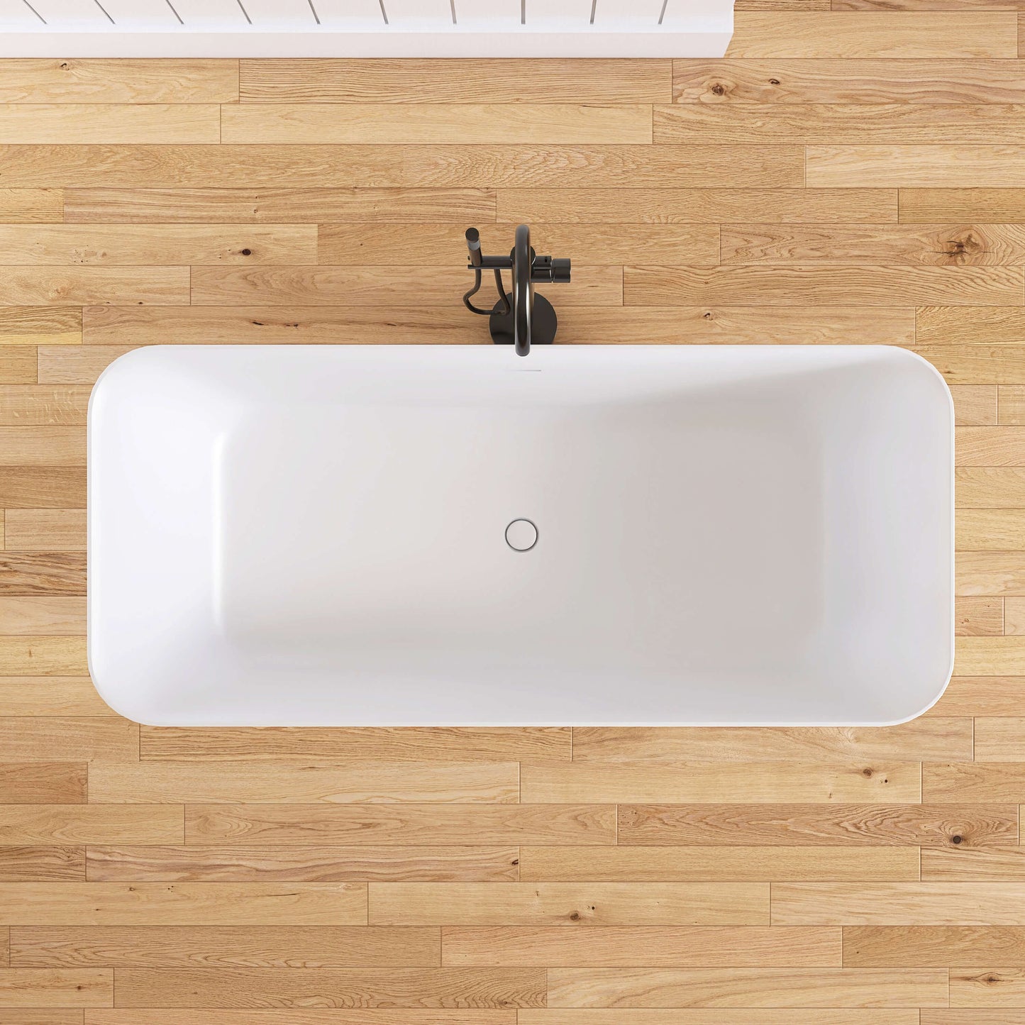 White freestanding bathtub on a wooden floor