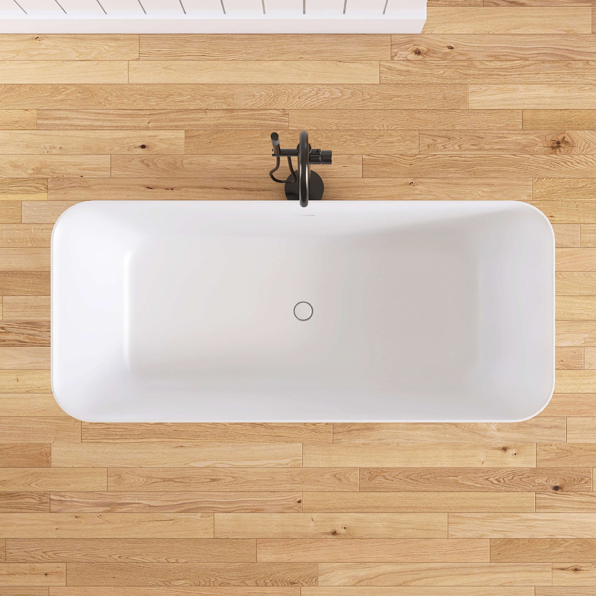 White freestanding bathtub on a wooden floor