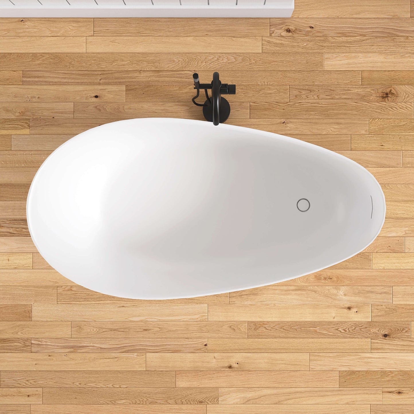 White oval sink on a wooden floor