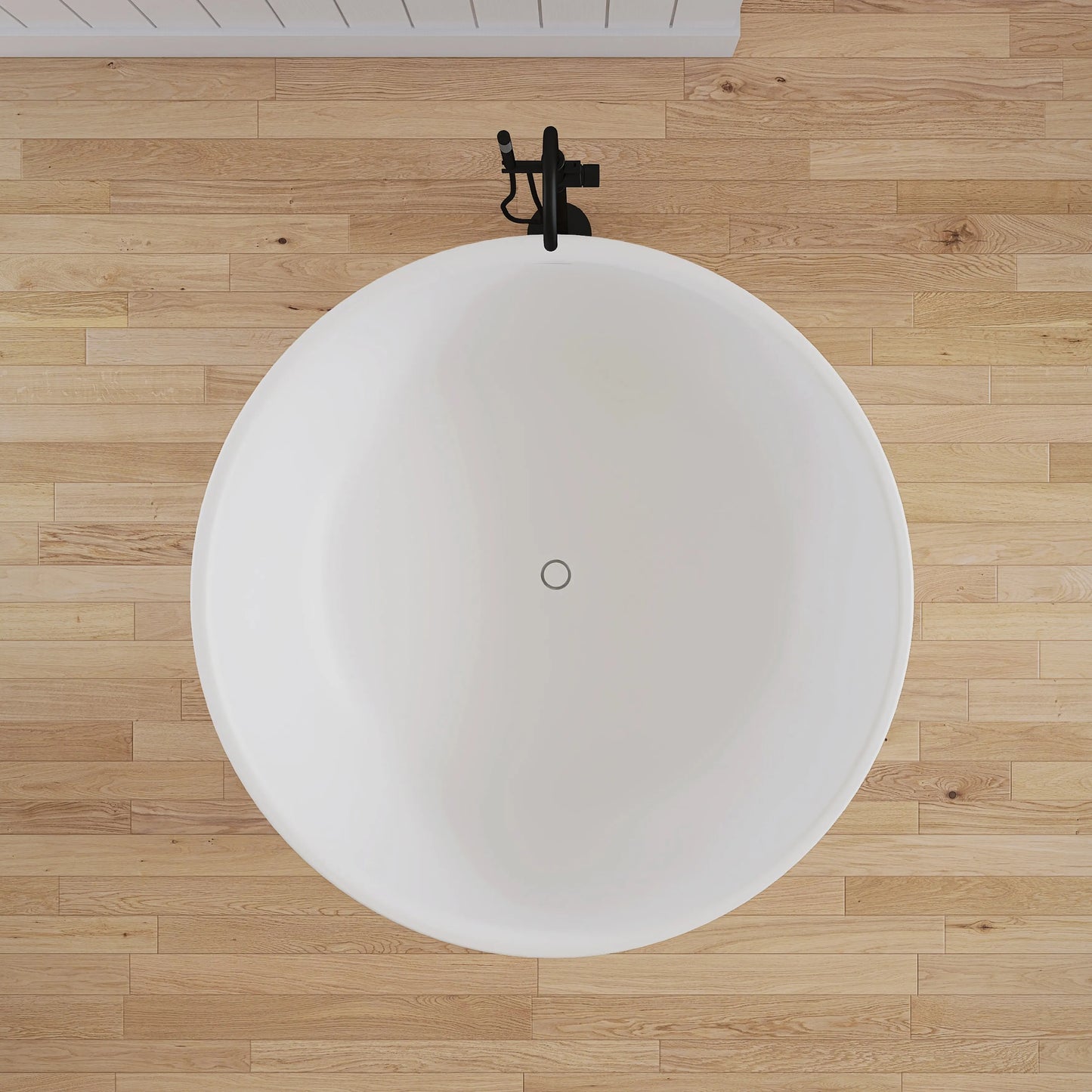 White round bathtub on a wooden floor
