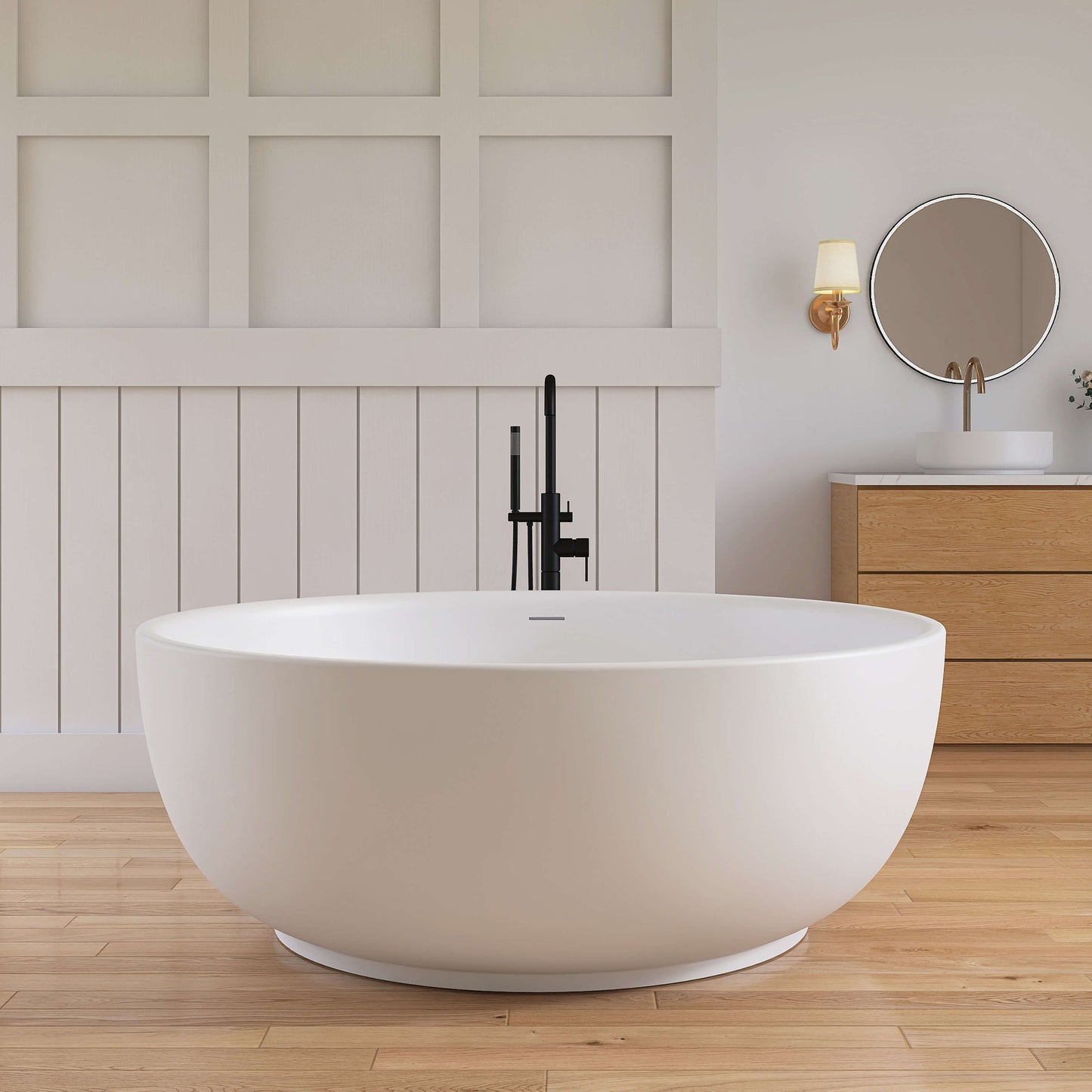 Modern white freestanding bathtub in a bathroom with wooden flooring and panelled walls.