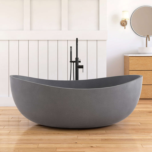 Gray freestanding bathtub in a modern bathroom with wooden floor and white walls.