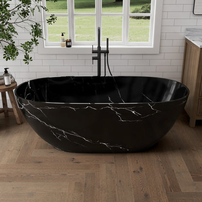 Black marble-patterned bathtub in a modern bathroom with a window and plant.