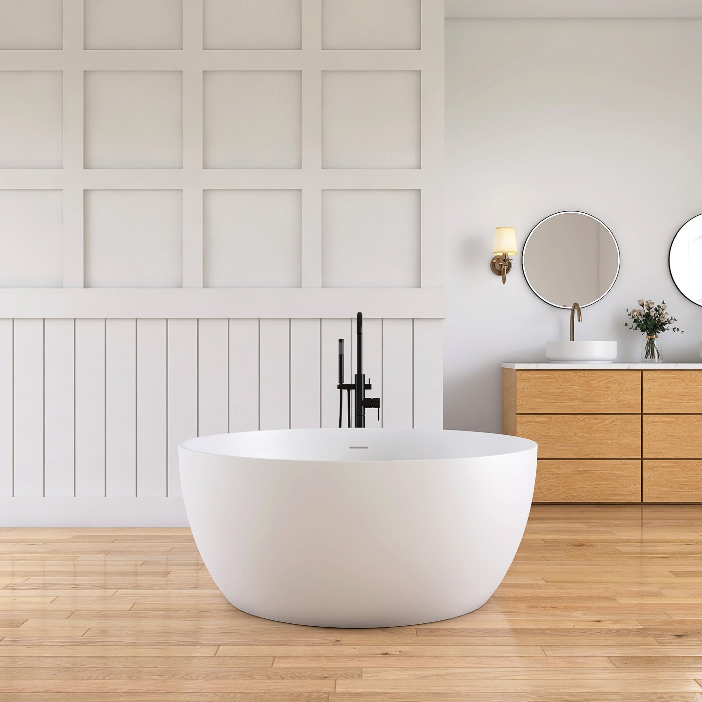 Modern bathroom with a freestanding bathtub, wooden vanity, and round mirrors.