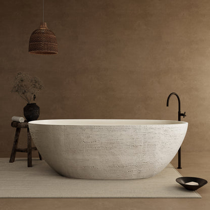 White freestanding bathtub in a room with a brown wall and decorative elements.