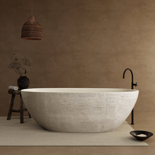 White freestanding bathtub in a room with a brown wall and decorative elements.